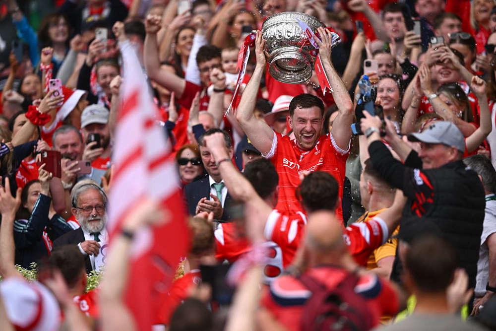 Louth GAA celebration with cup in county colours